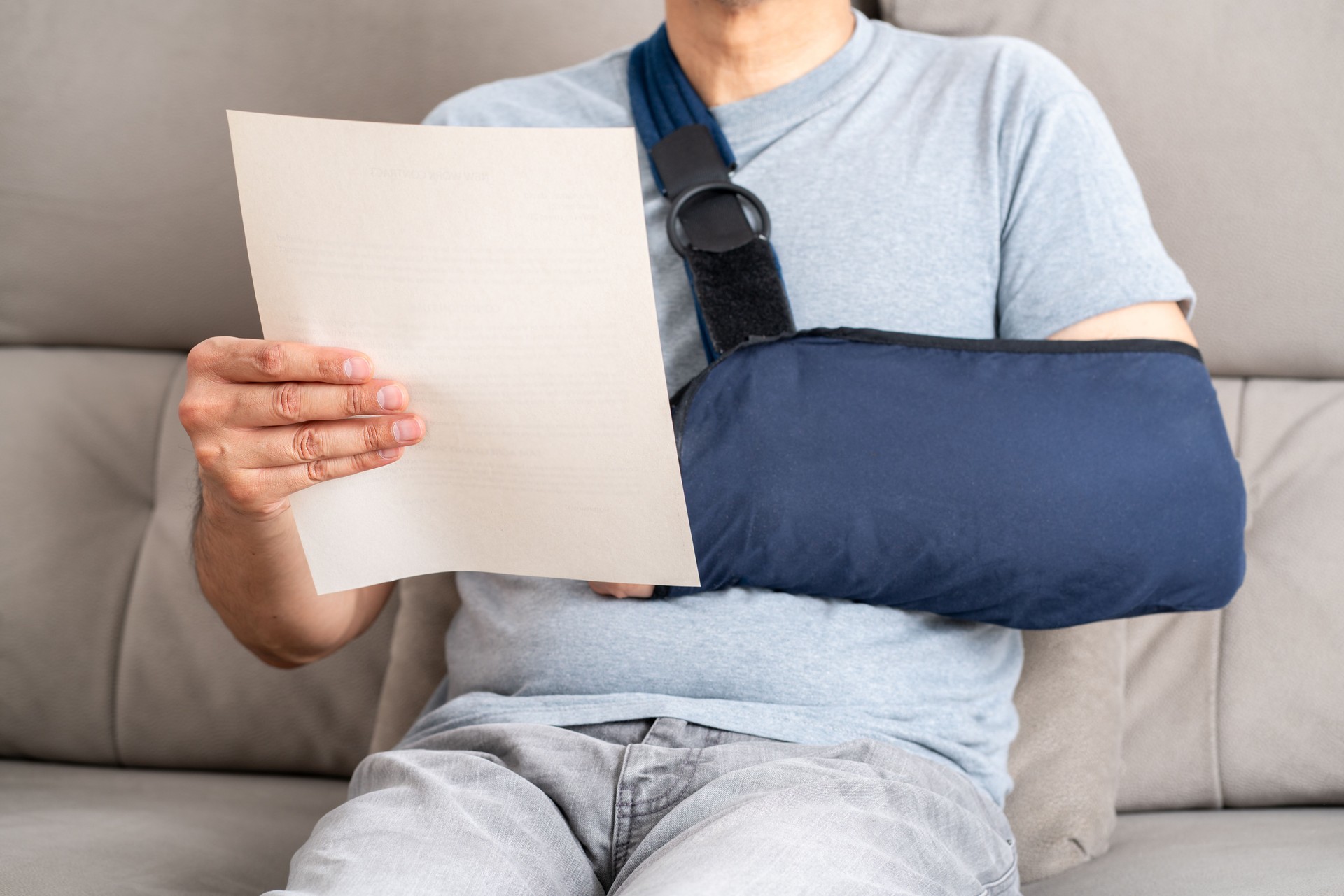 Reading letter about Injury and man compensation paperwork